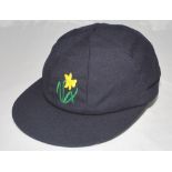 Glamorgan C.C.C. navy blue cloth 1st XI cricket cap with embroidered Glamorgan emblem of the