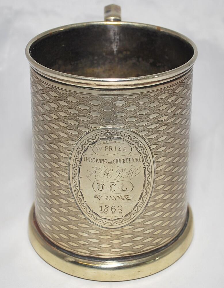 'Throwing the Cricket Ball 1869'. Silver plated tankard with glass star shape engraved base. The