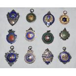 Silver cricket medals 1905-1940s. Twelve hallmarked silver with enamel cricket medals each with
