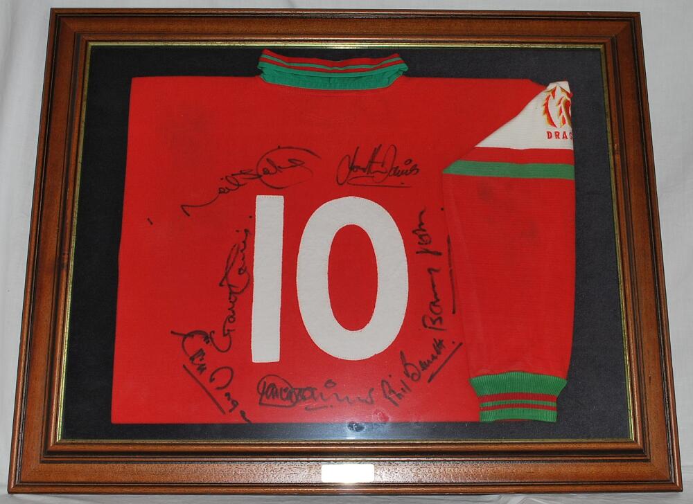 Rugby Union. 'Magnificent Seven'. Red Welsh rugby union 'number 10' shirt, signed by seven iconic