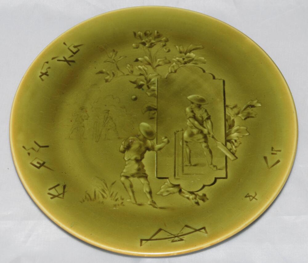 Cricket plate circa 1910. A rare Choisy Le-Roi Majolica green coloured cricket plate, green to