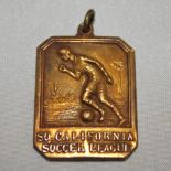 Southern California Soccer League 1932-33. A gilt base metal medal with and image of a player