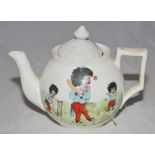 Cricket teapot. A small china teapot with to one side, three golliwogs playing cricket with title (