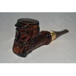 W.G. Grace. Brown glass after shave bottle by Avon in the shape of a pipe with head of Grace as