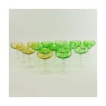 Lot of 17 Bohemian Cut Glass Champagne Coupes in Green (12) and Amber (5). Measure 5-5/8". Very goo