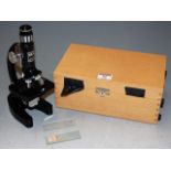 A modern student's monocular microscope, cased