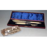 A cased set of Victorian silver plated fish servers together with a silver plated butter dish and