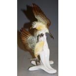 A Karl Ens Volkstedt porcelain figure group of a pair of linnets perched upon a branch, having