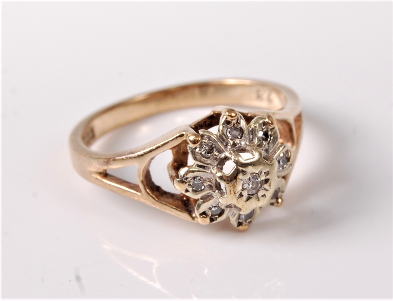A 9ct gold diamond cluster ring, all illusion mounted with open tapered shoulders and plain band - Image 2 of 2