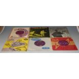 A box of assorted popular 7" vinyl singles
