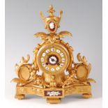 A Victorian gilt metal mantel clock under glass dome, the clock surmounted with a neo-classical