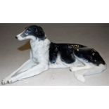 A Rosenthal German porcelain model of a recumbent dog, having printed mark verso, with original