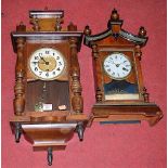 An early 20th century walnut and ebonised mantel clock, having an enamelled dial with Roman