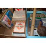 Two boxes of miscellaneous items to include various jigsaws, travel Monopoly, John Players cigarette