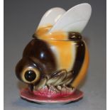 A Goebel novelty honey pot and cover in the form of a bee, having printed mark verso, impressed