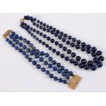 A three strand lapis lazuli bracelet with unmarked clasp (tests as approx. 9ct gold), 17cm long, and