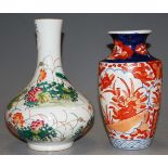 A Chinese bottle vase enamel decorated with birds amongst foliage having red seal mark verso, height