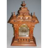 A circa 1900 German walnut cased mantel clock, with 14 day striking movement, h.61cm