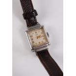A lady's Tudor Royal wristwatch, the square dial with gilt Arabic numerals and hands, black