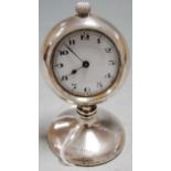 A George V silver pocket watch holder containing an early 20th century nickel cased open face pocket