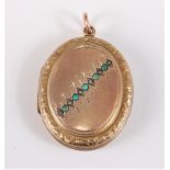 An unmarked oval locket set with small turquoise cabochons and seed pearls, 38mm long, (13.3g)