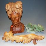 A carved and polished hardstone figure of a dragon; together with a modern carved wooden bust; and a