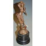 A bronze metal figure of an Indian deity on wooden socle base, height 28cm