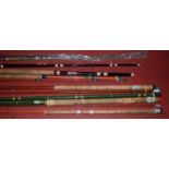 A collection of assorted fishing rods to include two piece split cane example, etc