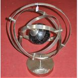 A modern polished metal armillary sphere, h.78cm