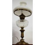 An early 20th century oil lamp, having opalescent glass shade and clear glass font on pedestal