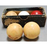 Three Victorian ivory billiard balls together with two others (5)