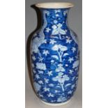 A large Chinese blue and white vase, of baluster form, decorated with a dragon amongst flowers and