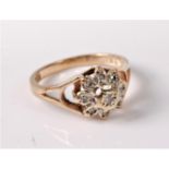 A 9ct gold diamond cluster ring, all illusion mounted with open tapered shoulders and plain band