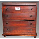 A Victorian mahogany apprentice piece chest of four long drawers, on turned feet, w.24cm