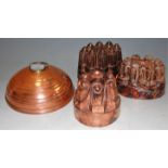 Three Victorian copper castle-top jelly moulds; together with a Wafax copper bed-warmer (4)