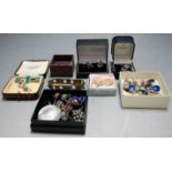 A large collection of assorted costume jewellery to include enamel butterfly brooches, earrings,