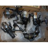 A single box of various fishing reels to include one pair of Wychwood Rogue Freespin reels, one