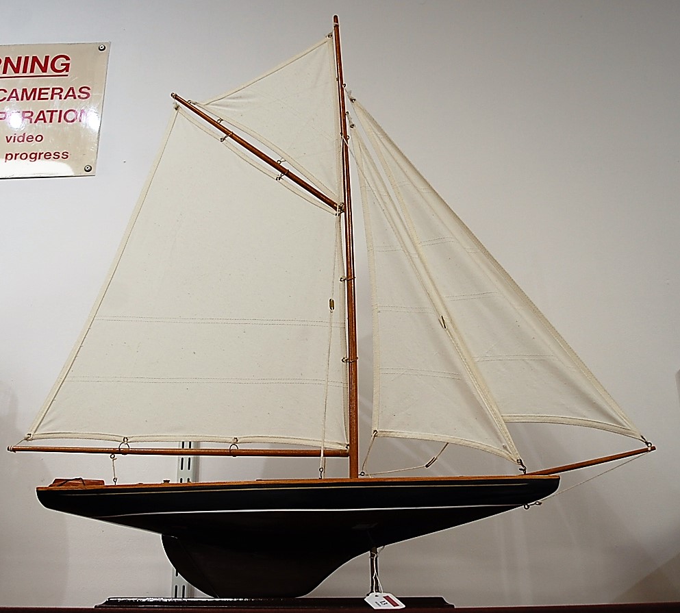 A mid-20th century painted pond yacht, with full rigging, on painted plinth, h.86cm