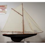 A mid-20th century painted pond yacht, with full rigging, on painted plinth, h.86cm