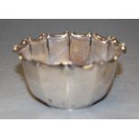 A George V silver sugar bowl of fluted form