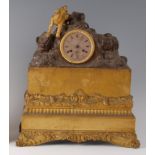 A circa 1840 French bronze and gilt bronze mantel clock, the indistinctly signed engine turned