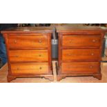 A pair of miniature mahogany chests each fitted with three long drawers within fluted angles on