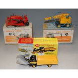 A Dinky Supertoys snow plough, No.958; Coles mobile crane No.571; and Blaq Knox bulldozer No.561,