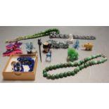 A box of mixed costume jewellery to include glass beads, shell,etc and a small quantity of glass
