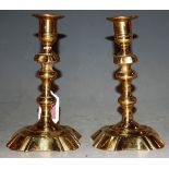 A pair of 18th century brass candlesticks with multiknopped stems, 18cm