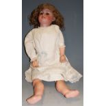 An early 20th century Simon & Halbig bisque headed doll, having rolling brown eyes, open mouth