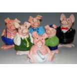 A set of six Wade Nat West pig money boxes