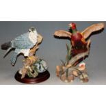 A modern Franklin Mint porcelain model of a ring-necked pheasant, by A.J. Rudisill, h.31cm; together