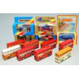 A collection of Matchbox diecast London buses and Matchbox MB 38 series model Fords, in boxes