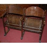A pair of bent ply cinema style seats, with floor fixing points